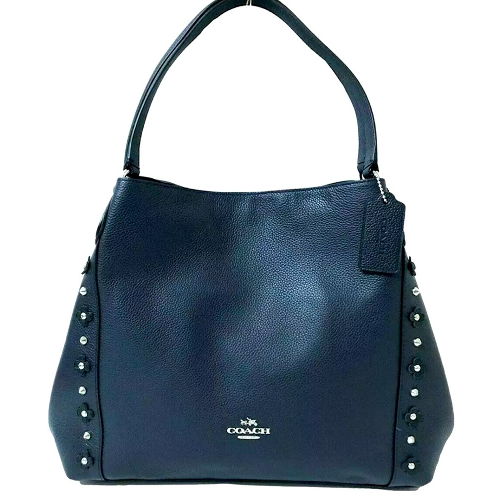 Like new condition Coach Floral Rivets.